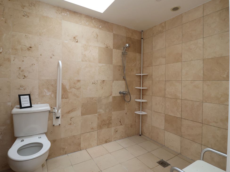 A bathroom with a shower and toilet at Stable Cottage in Cawton near Hovingham