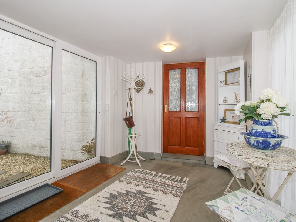 An entrance with a door, coat rack, and table at Southview in Clee Hill near Ludlow