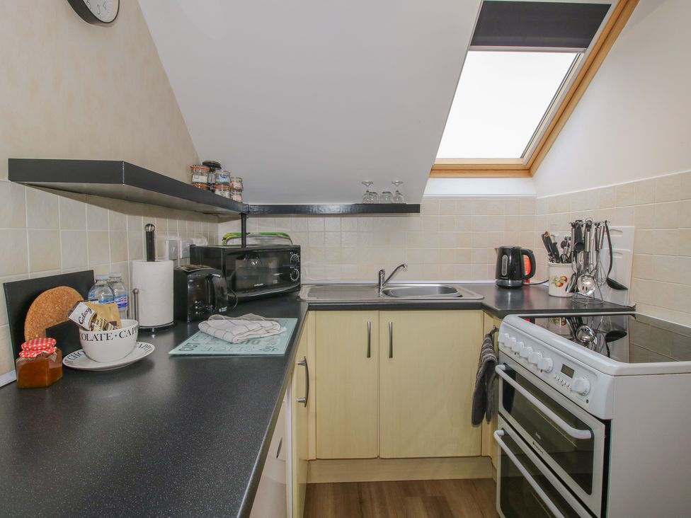 A kitchen with a sink and stove at Southview in Clee Hill near Ludlow