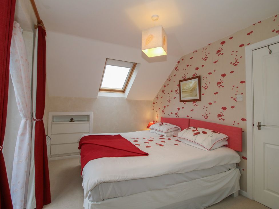 A bedroom with a bed and wardrobe at Southview, Clee Hill near Ludlow