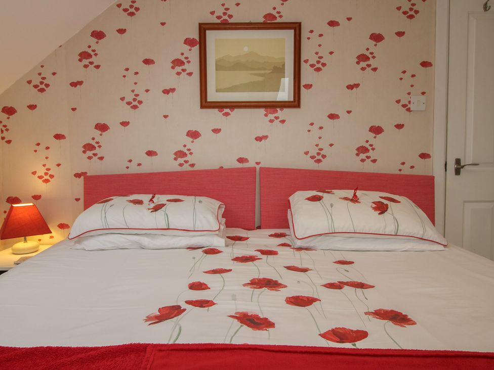 A bedroom with a bed and lamp at Southview Clee Hill near Ludlow
