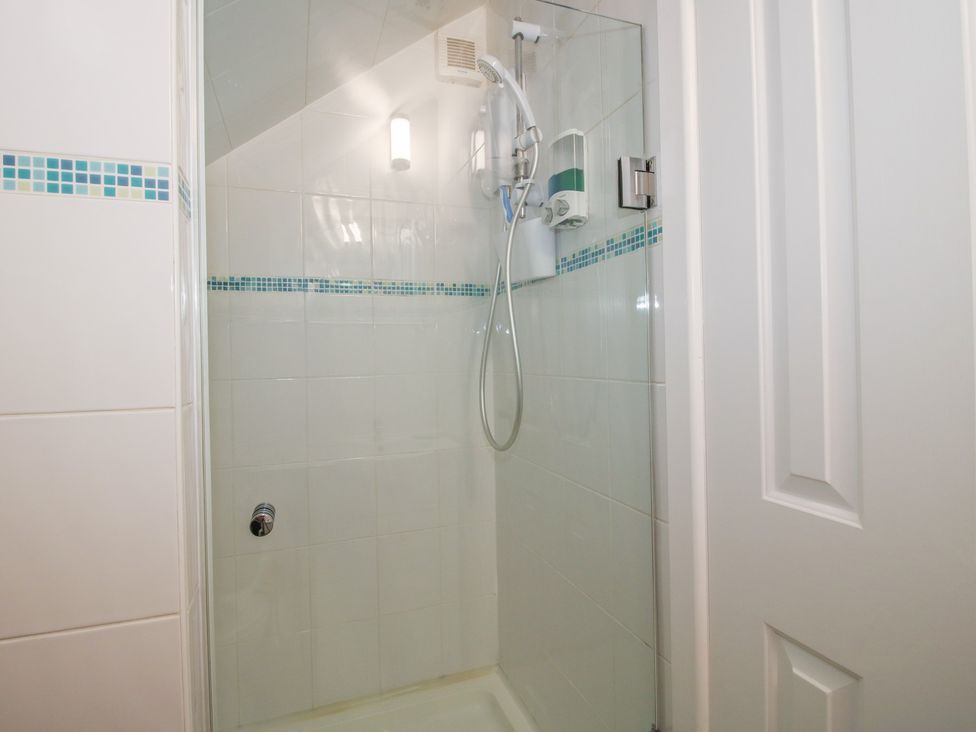 A shower with tiles and a showerhead at Southview in Clee Hill near Ludlow