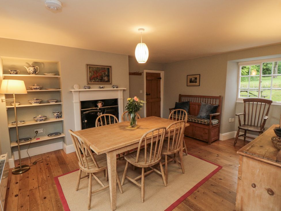 A dining room with a table and chairs at Brookleigh Hutton-le-Hole