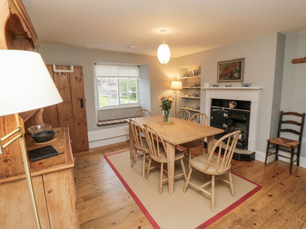 A dining room with a table and chairs at Brookleigh in Hutton-le-Hole