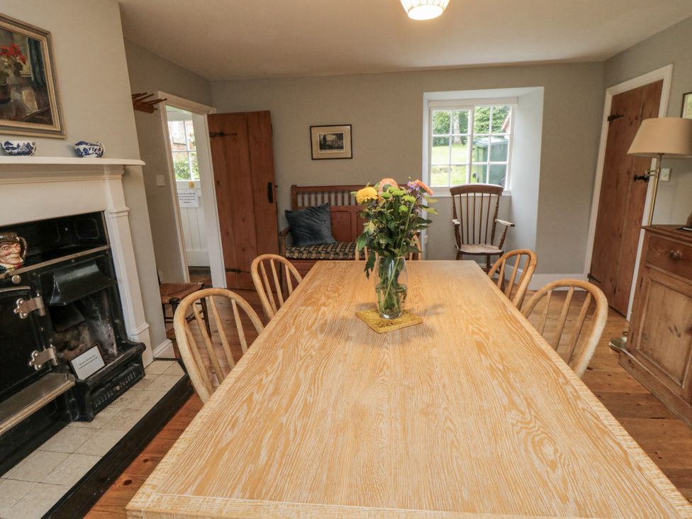 A dining room with a table and chairs at Brookleigh in Hutton-le-Hole
