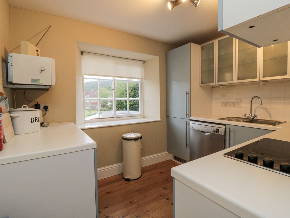 A kitchen with a window and appliances at Brookleigh in Hutton-le-Hole