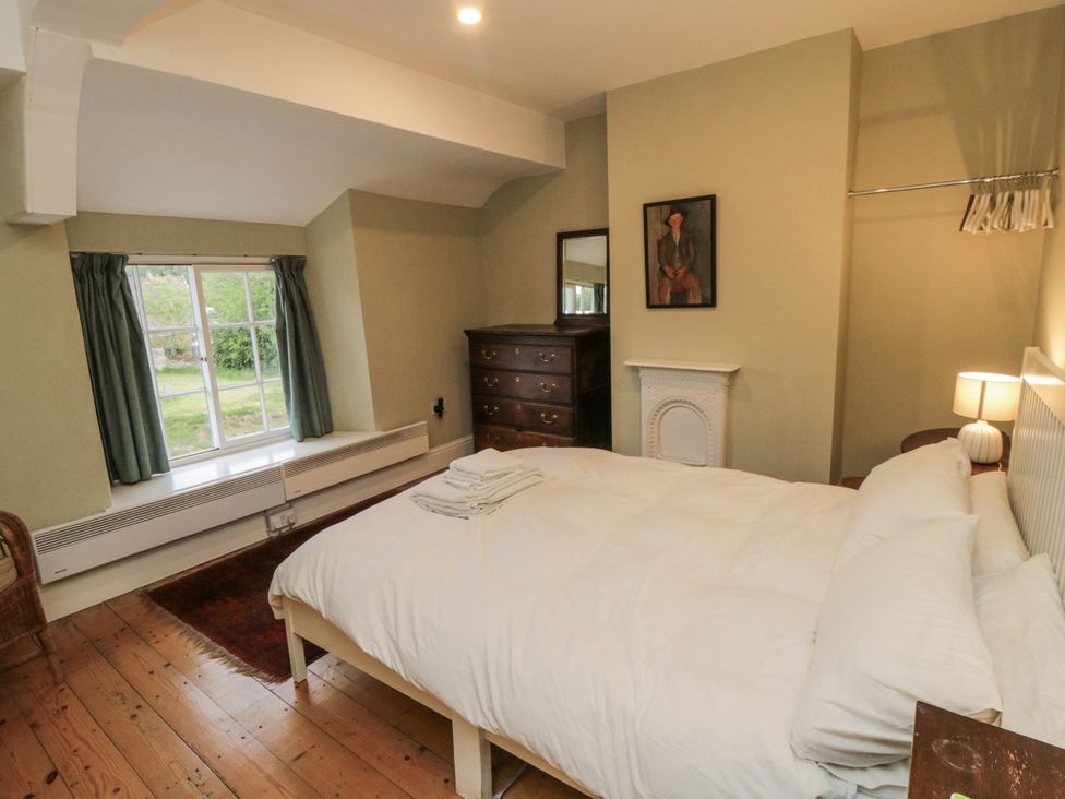 A bedroom with a bed and window at Brookleigh in Hutton-le-Hole