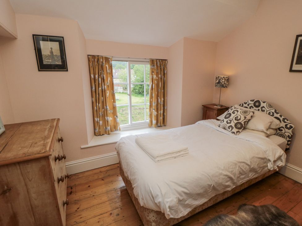 A bedroom with a bed and dresser at Brookleigh Hutton-le-Hole