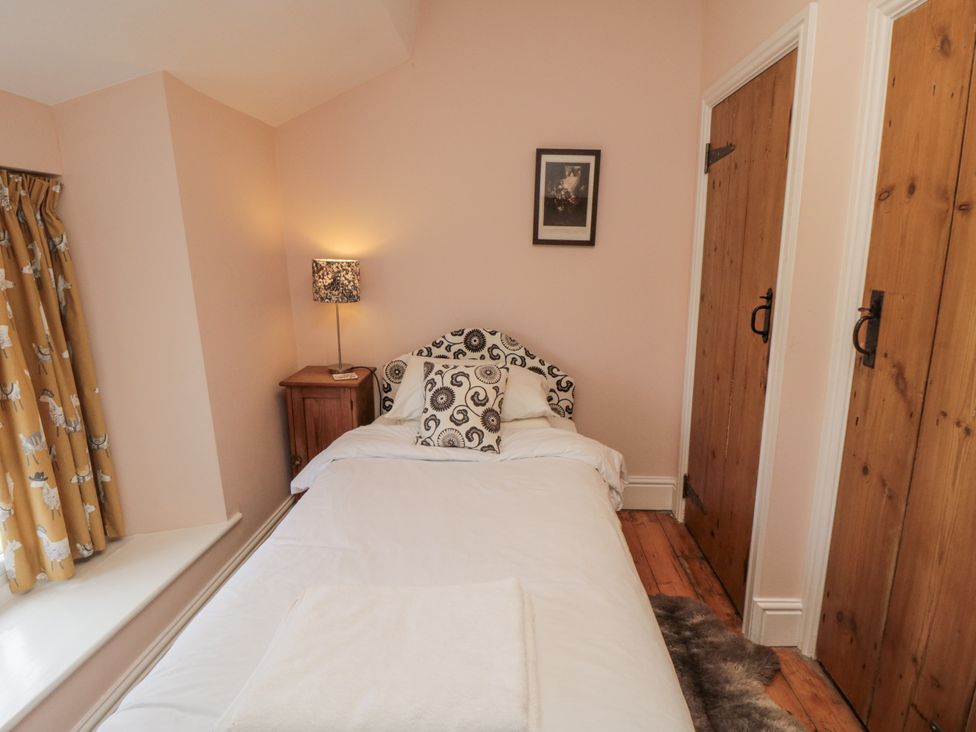 A bedroom with a single bed and a bedside table at Brookleigh in Hutton-le-Hole