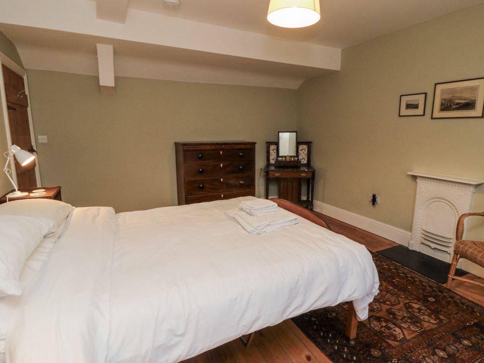 A bedroom with a bed and dresser at Brookleigh in Hutton-le-Hole
