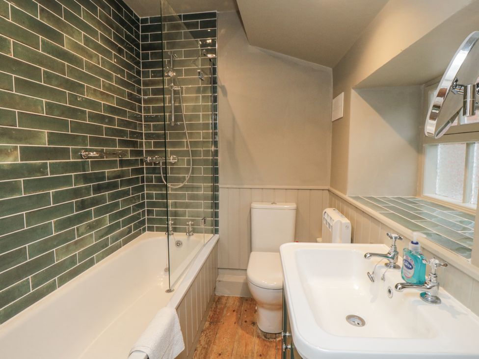 A bathroom with a bathtub, shower, sink, and toilet at Brookleigh in Hutton-le-Hole