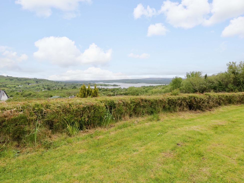 A view of a lake and landscape from a grassy area at Ballaghboy Cottage in Boyle, County Sligo