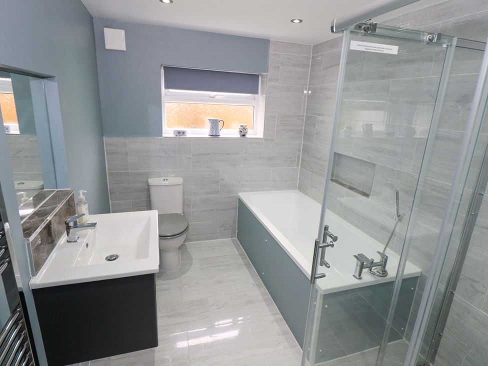 A bathroom with a bathtub and shower at Ballaghboy Cottage in Boyle, County Sligo