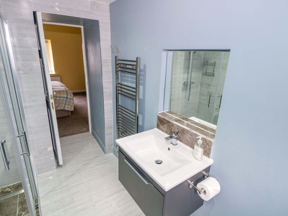A bathroom with sink and shower at Ballaghboy Cottage in Boyle, County Sligo