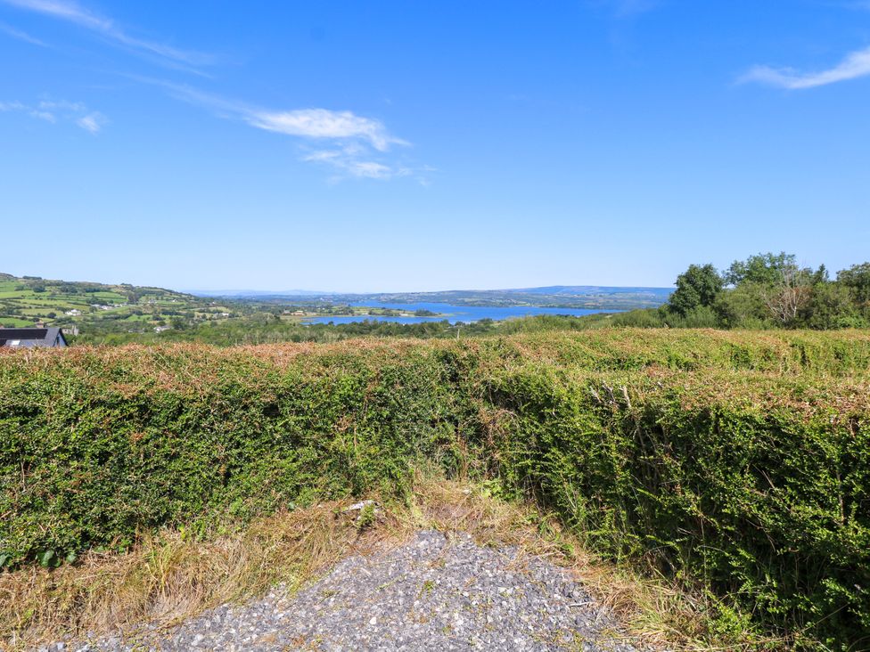 A view of a hedge and lake at Ballaghboy Cottage in Boyle, County Sligo