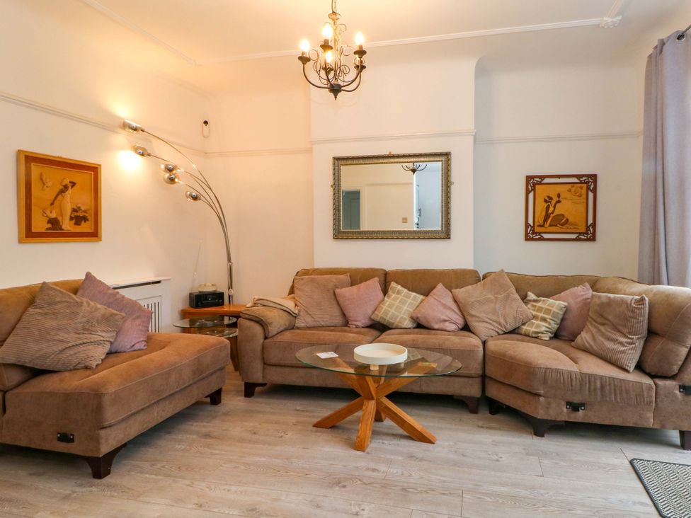 A living room with a sofa and coffee table at Thomas Lane in Liverpool