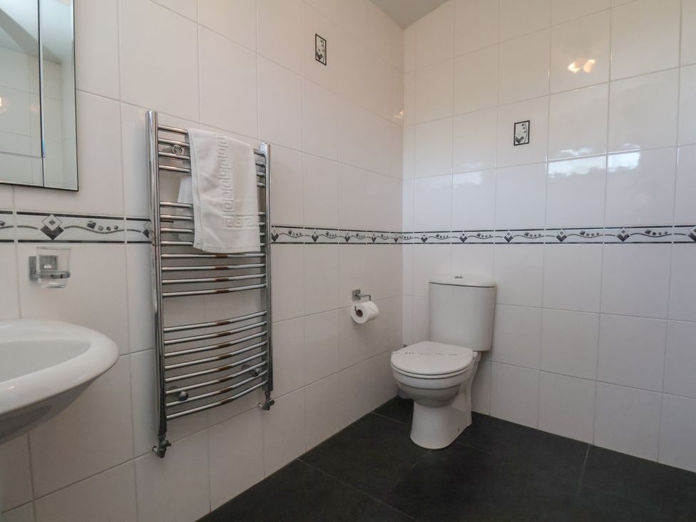 A bathroom with a towel rack and toilet at Bluebell Lodge in Saltburn-by-the-Sea