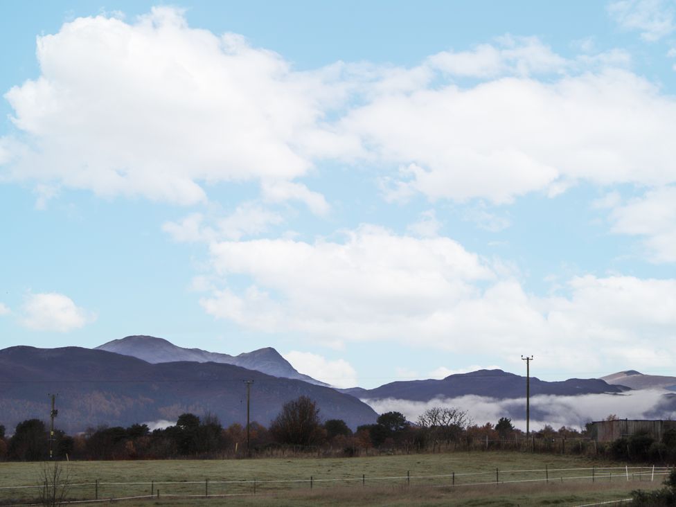 A scenic view of mountains and clouds at The Croft House in Muir of Ord near Beauly