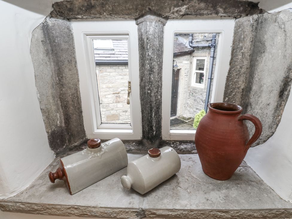 A window with ceramic bottles and a jug at Chamber End Fold Grassington