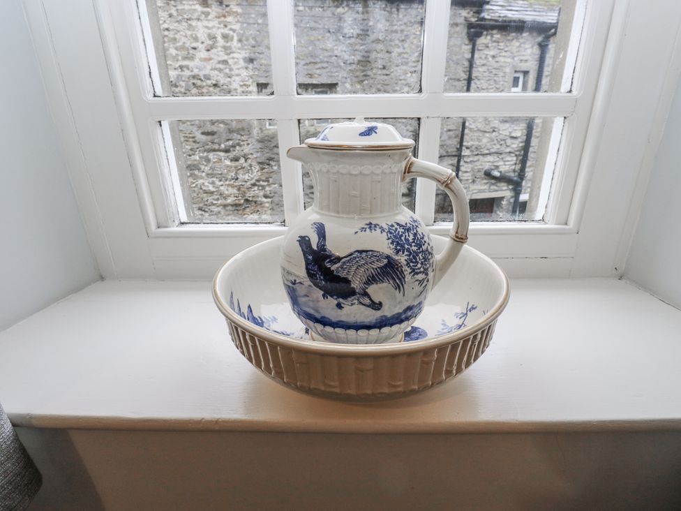 A jug and basin on a windowsill at Chamber End Fold Grassington