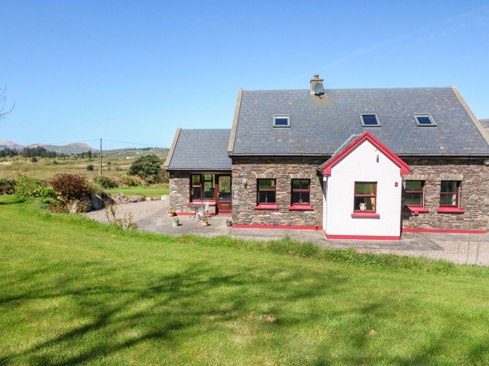 A house with a stone exterior and windows in Waterville, County Kerry
