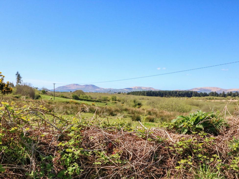 A scenic view of mountains and grassland at Stone Cottage Waterville, County Kerry