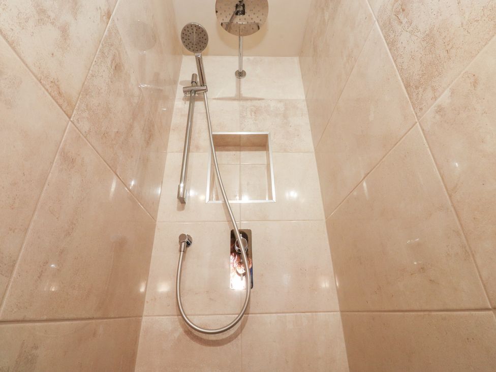 A shower with tiles and fixture in Sandywood Burnsall near Grassington