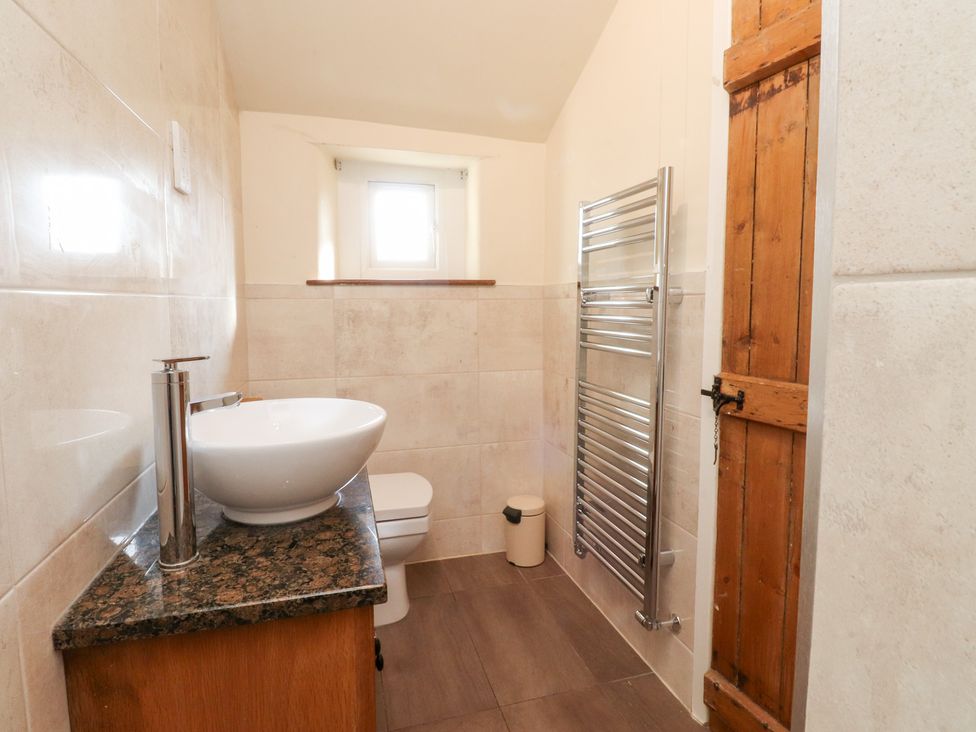 A bathroom with a sink and toilet at Sandywood Burnsall near Grassington