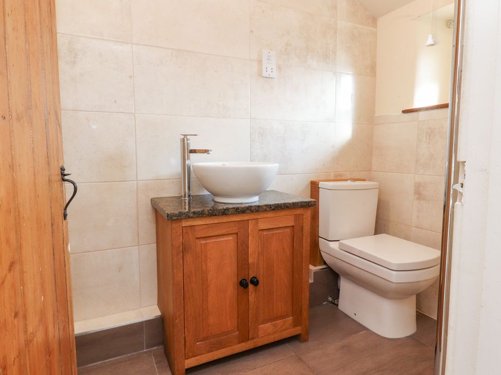 A bathroom with a sink and a toilet at Sandywood in Burnsall near Grassington