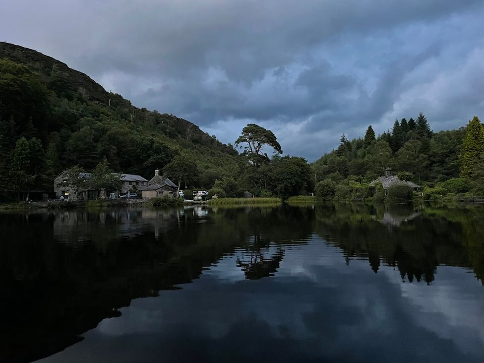 A landscape with a lake and buildings at Tafarn Trip in Tan Y Bwlch, Maentwrog