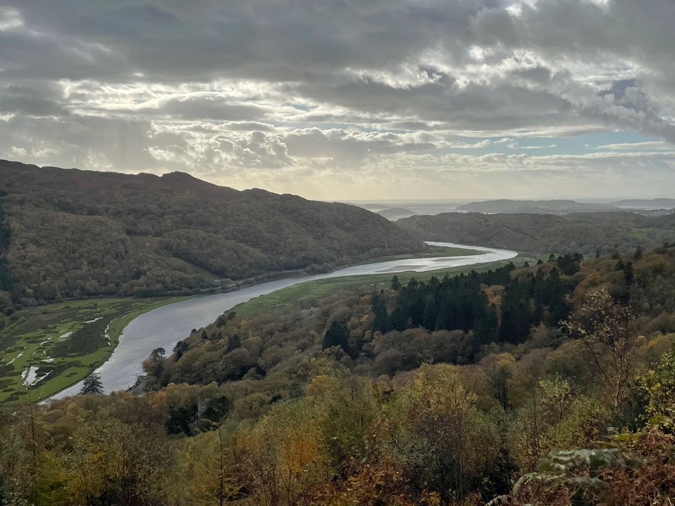 A view of a river winding through forests and hills at Tafarn Trip in Tan Y Bwlch, Maentwrog