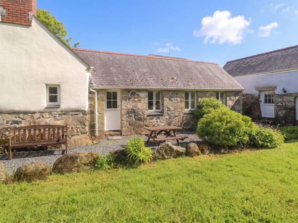 A house with a table and bench in front at Swallows, St Keverne, Lizard Peninsula