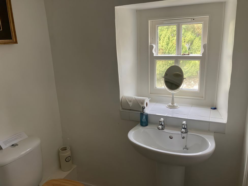 A bathroom with a sink and toilet at The Old Post Office in Marrick near Reeth