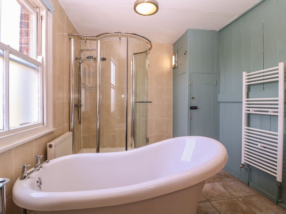 A bathroom with a bath tub and a shower at The Lock House in Gloucester