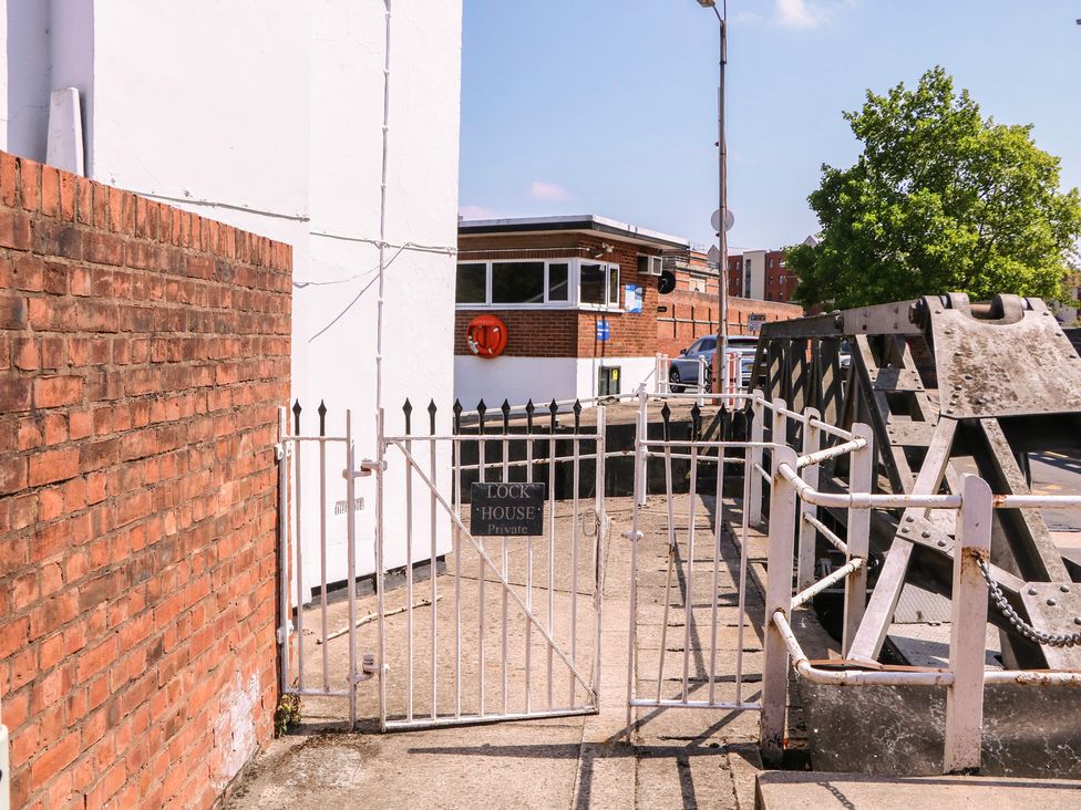 A gate leading to The Lock House in Gloucester