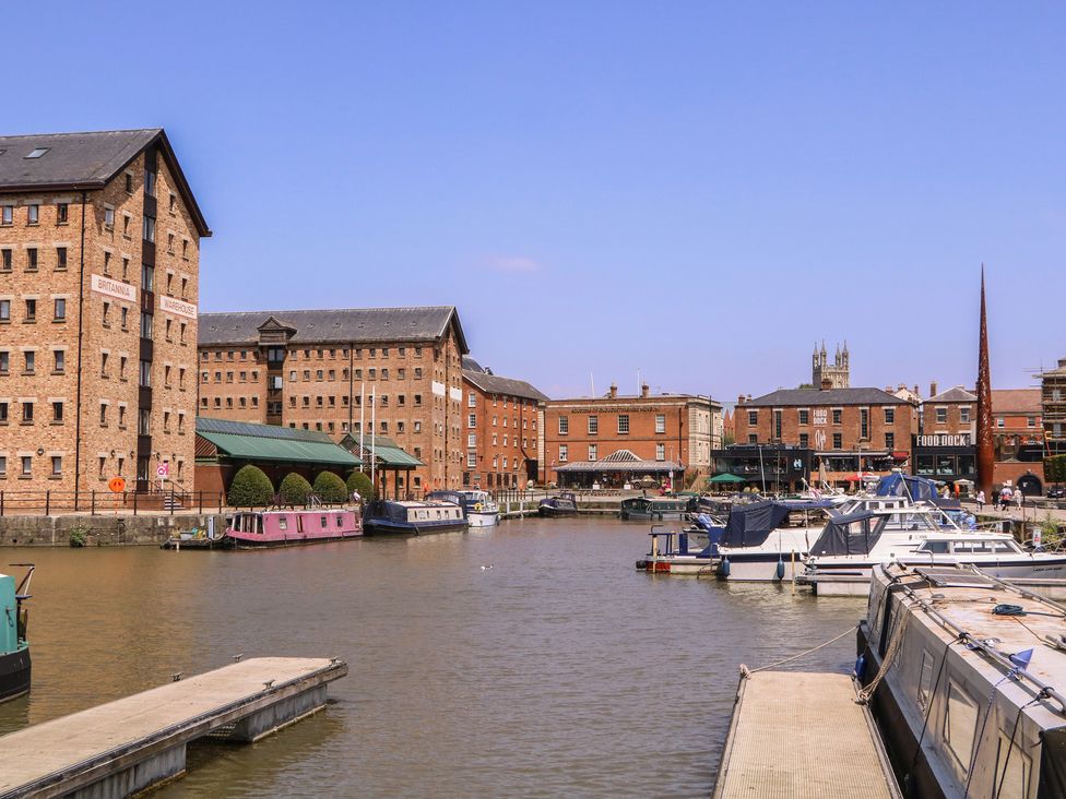 A marina with boats and buildings at The Lock House in Gloucester