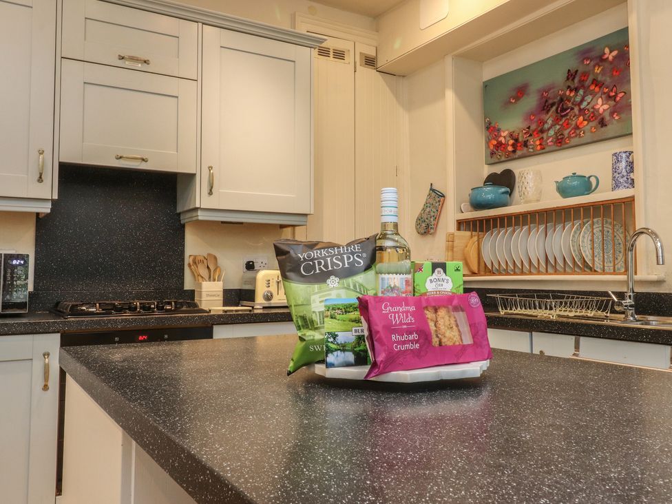 A kitchen with various food items on the counter at Canalside Cottage in Farnhill near Skipton