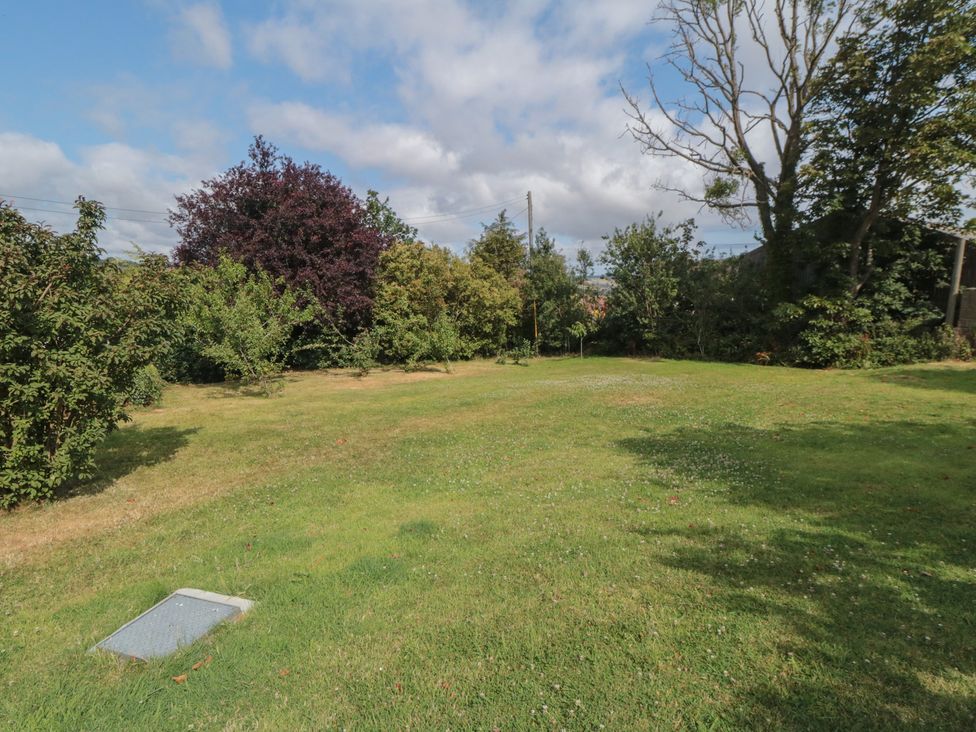 A garden with trees and grass at 1 Brow Cottages Green End near Goathland