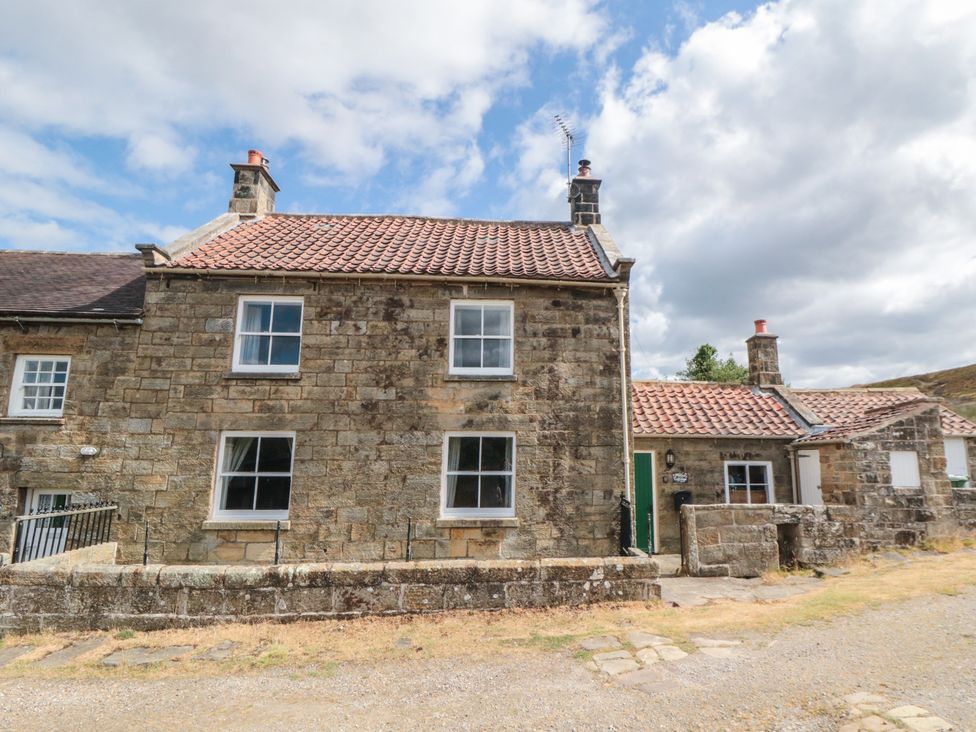 A house exterior with windows and a door at 1 Brow Cottages in Green End near Goathland