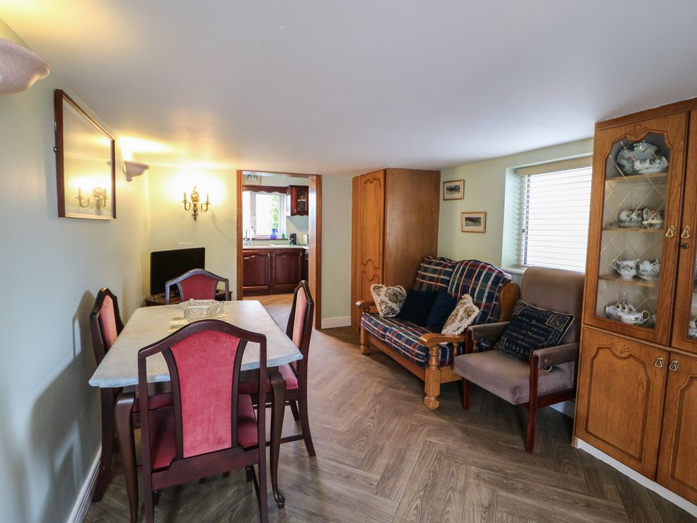 A dining room with a table and chairs at The Farmhouse in Dunmanway, County Cork