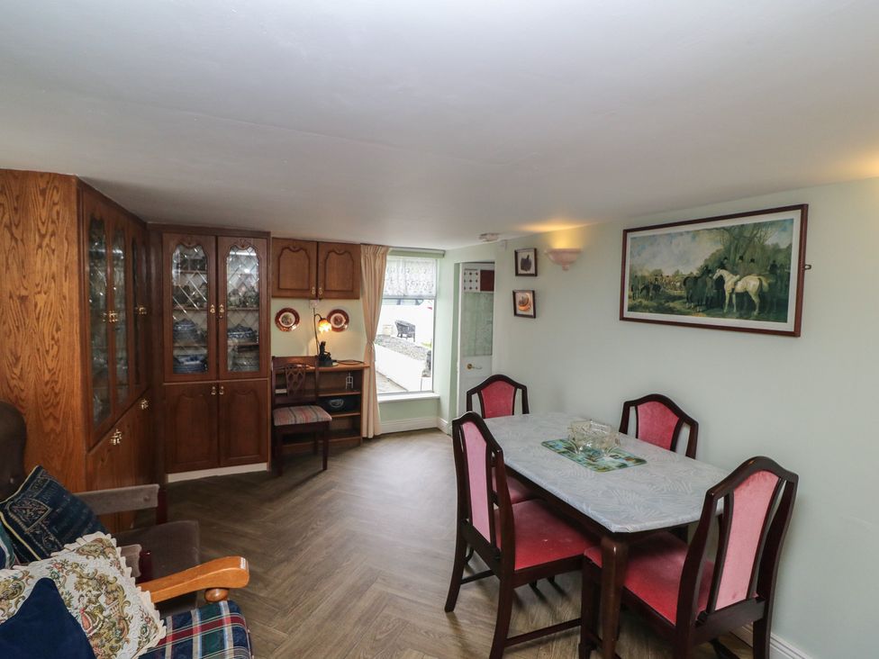 A dining room with a table and chairs at The Farmhouse in Dunmanway, County Cork