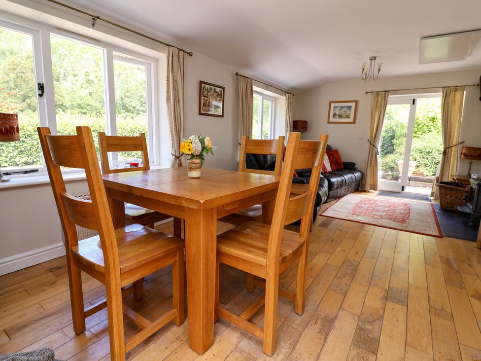 A dining room with a table and chairs at The Lambing Shed Dyserth near Prestatyn