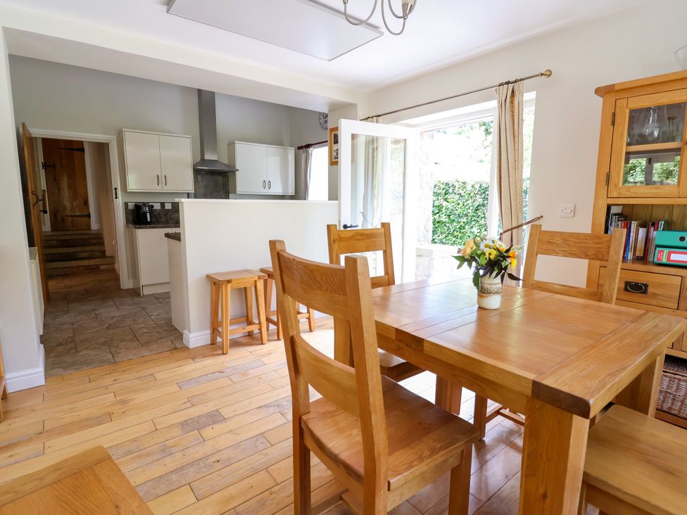 A dining room with a table and chairs at The Lambing Shed in Dyserth near Prestatyn