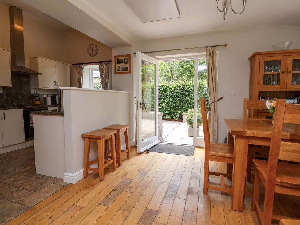 A dining room with a table and chairs at The Lambing Shed Dyserth near Prestatyn
