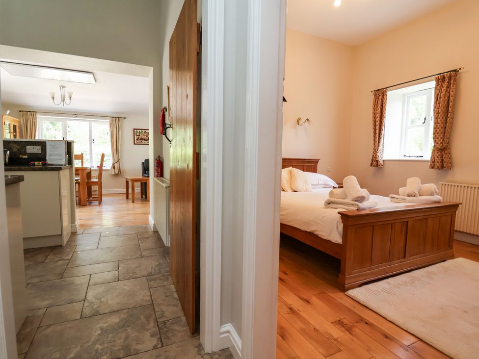 A kitchen and bedroom area at The Lambing Shed in Dyserth near Prestatyn