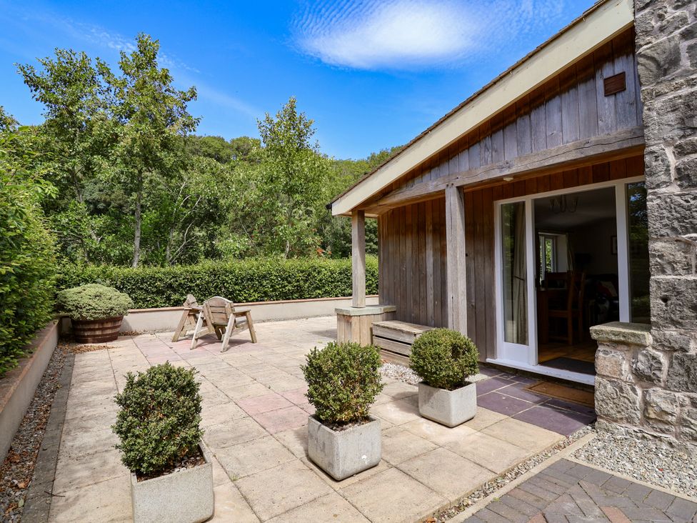 An outdoor area with a table and chairs at The Lambing Shed Dyserth near Prestatyn