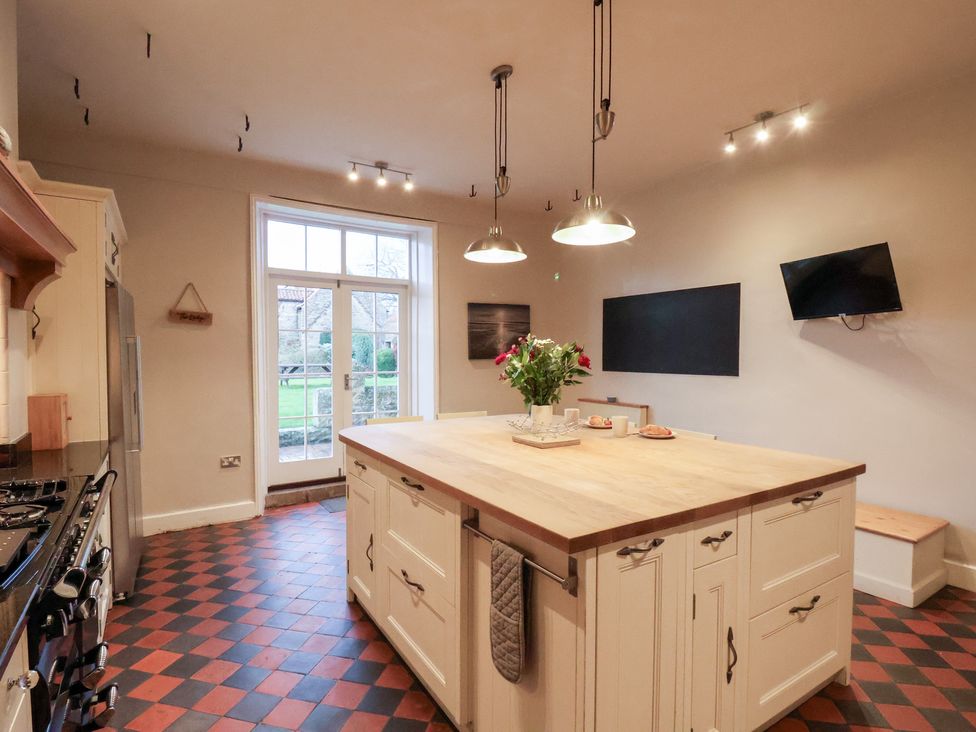 A kitchen with an island and appliances at The Lodge in Snainton near Scarborough