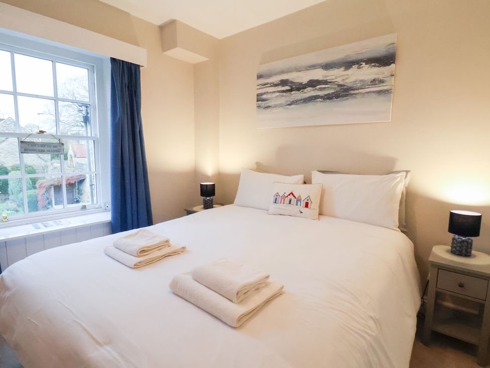 A bedroom with a double bed and two bedside lamps at The Lodge in Snainton near Scarborough