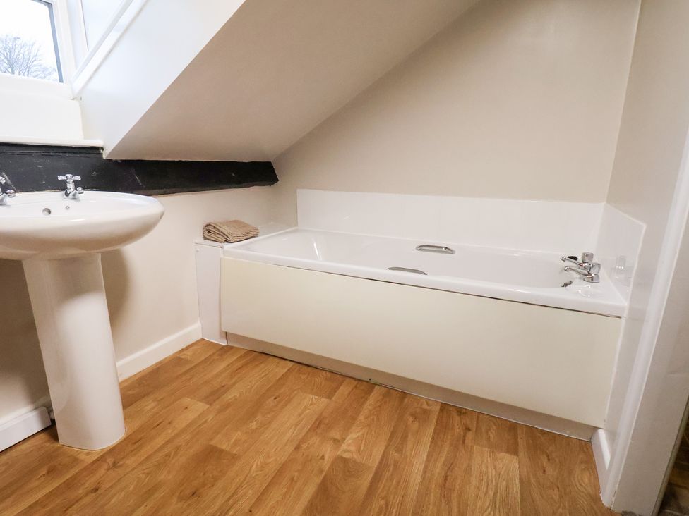 A bathroom with a sink and bathtub at The Lodge Snainton near Scarborough