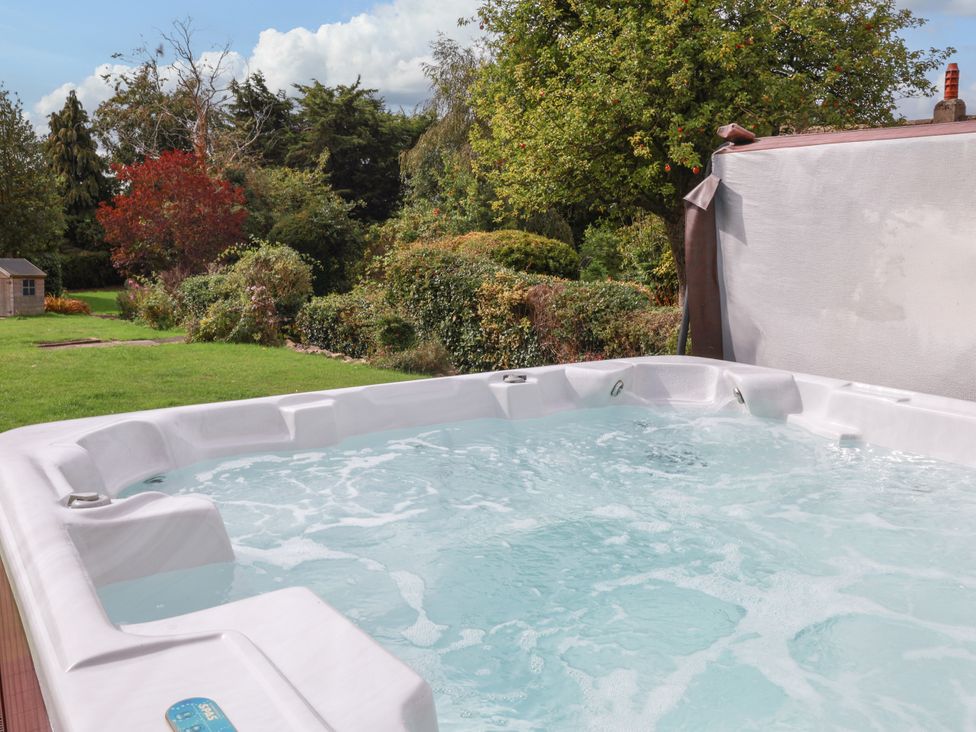 A hot tub with water in a garden at The Lodge Snainton near Scarborough
